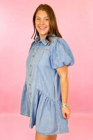 Lightwash denim dress with button down front, puff sleeves, and side pockets. Concert dress. summer dress. casaul dress.