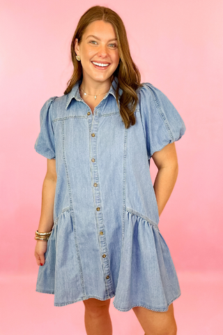 Lightwash denim dress with button down front, puff sleeves, and side pockets. Concert dress. summer dress. casaul dress.