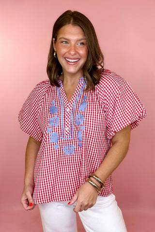 red and white checkered blouse with blue floral embroidery