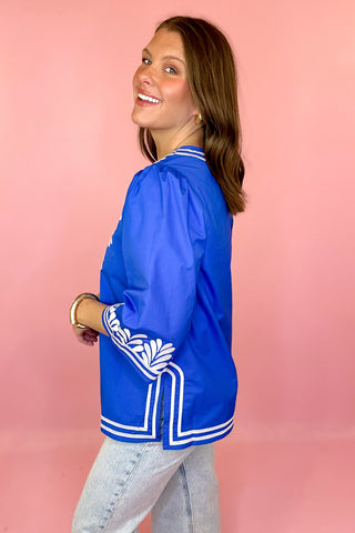 royal blue top with white embroidery