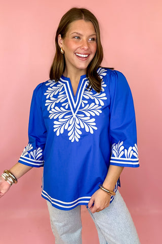 royal blue top with white embroidery
