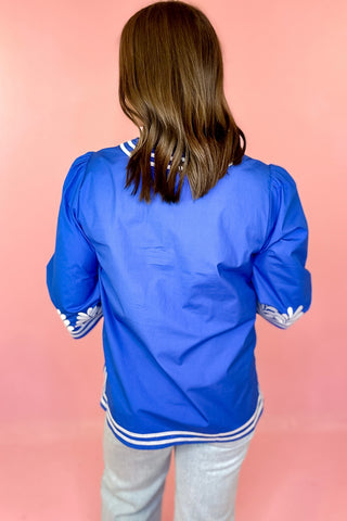 royal blue top with white embroidery