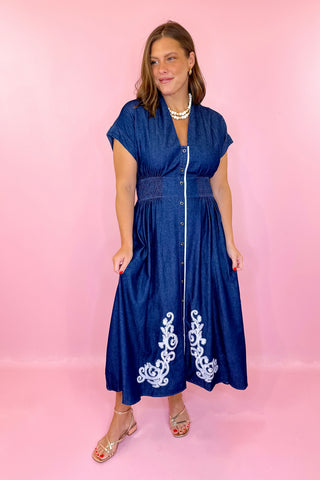 Dark blue denim dress with white embroidery
