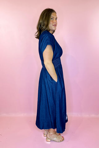 Dark blue denim dress with white embroidery