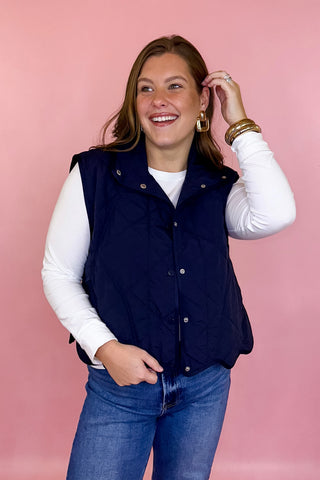 scalloped quilted vest