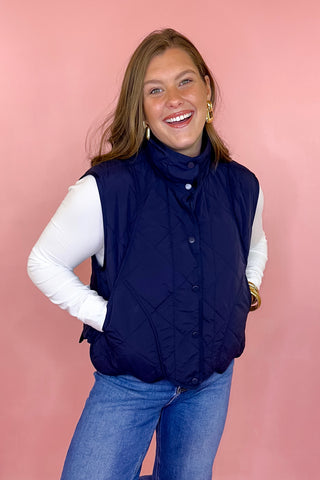 scalloped quilted vest