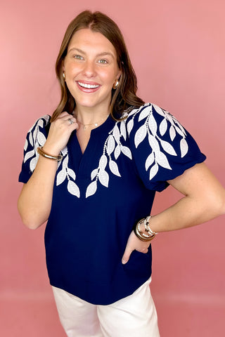 navy and white embroidered top