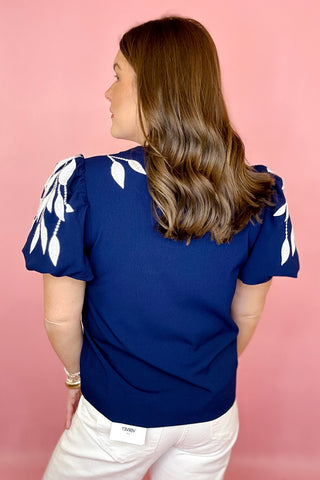 navy and white embroidered top