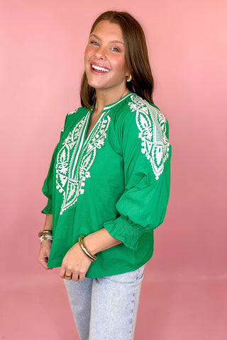 green top with white embroidery