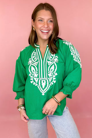 green top with white embroidery
