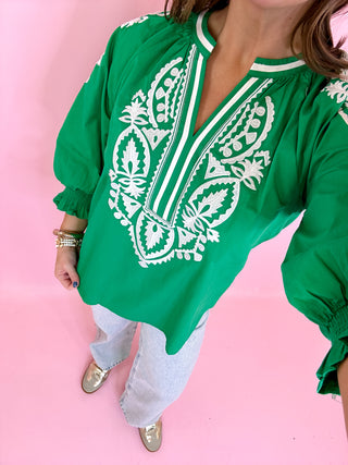 green top with white embroidery